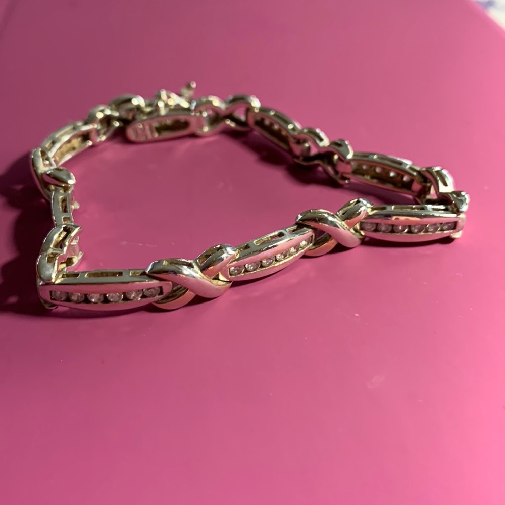 Sterling silver bracelet with CZ accents.